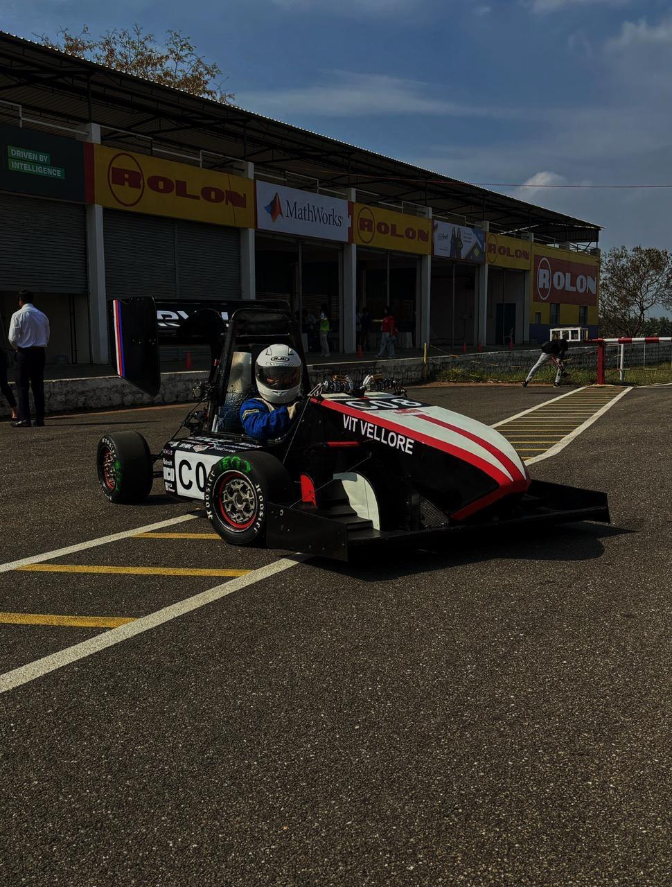 Pravega Racing formula-style race car at the track